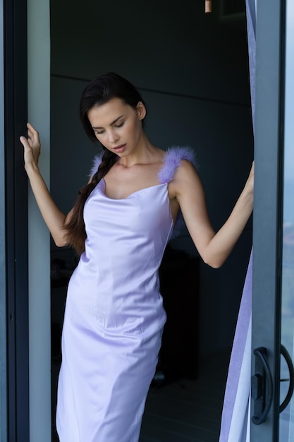 Fashion portrait of beautiful brunette woman posing in stylish evening dress outdoor natural daylight