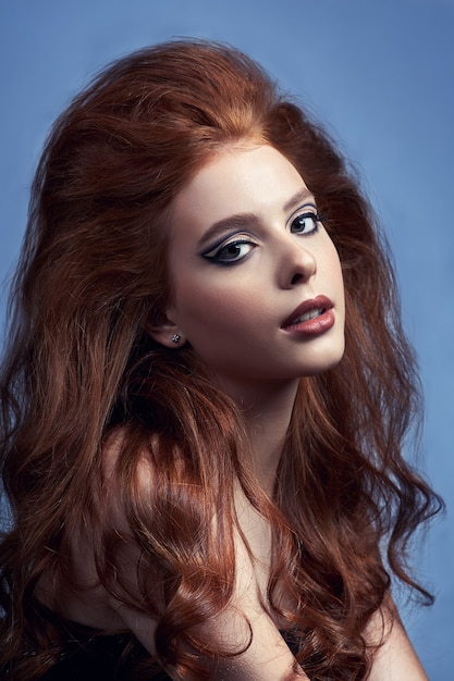 Fashion portrait of beautiful red hair woman