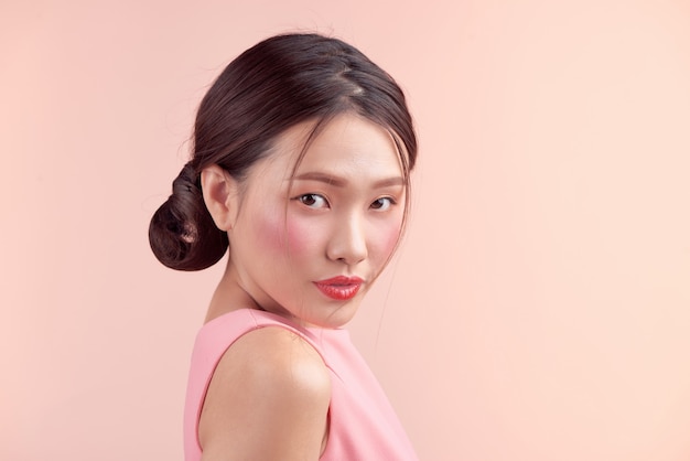 Fashion portrait of a beautiful young woman in a pretty dress