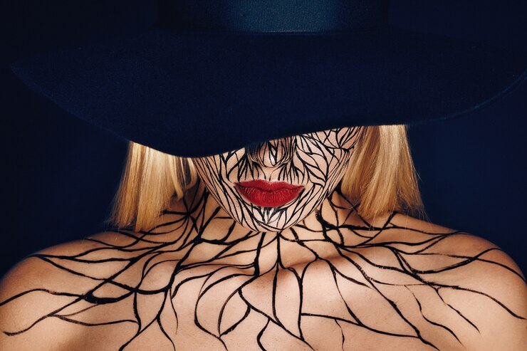 Fashion portrait of girl with faceart and red lips