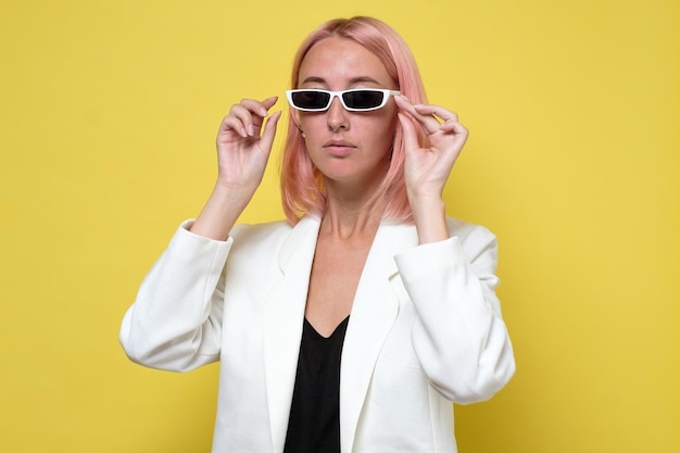 Fashion portrait of serious woman in sunglasses