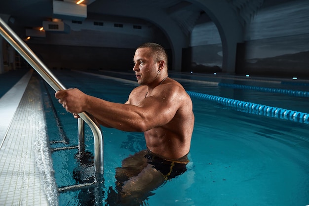 Fashion Portrait Of A Very Muscular Sexy Man In Underwear At Swimming Pool