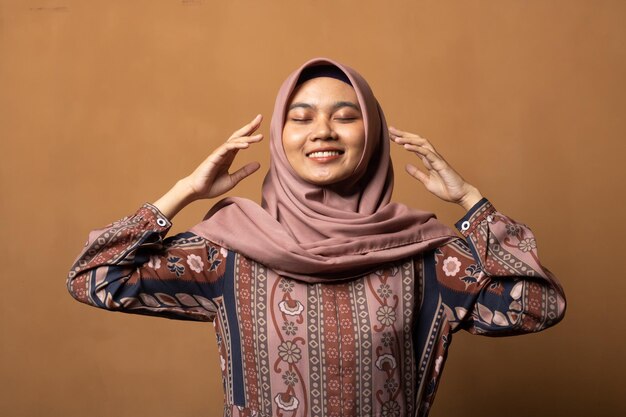 Fashion portrait of young beautiful asian muslim relaxing mind pose concept