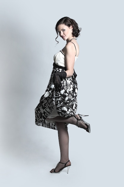 Fashion portrait of young beautiful woman in the black dress