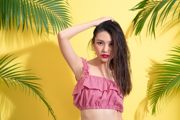 Fashion portrait of a young model with wet long hair. Perfect skin and make-up.