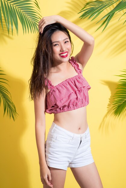 Fashion portrait of a young model with wet long hair. Perfect skin and make-up.