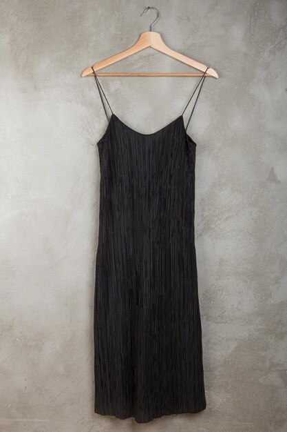 Fashion and shopping concept beautiful little black dress on a hanger