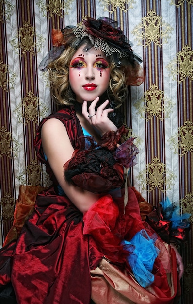 Fashion shot of woman in doll style. Creative make-up.Fantasy dress.