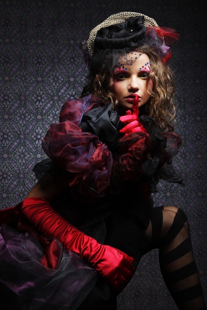 Fashion shot of woman in doll styleCreative makeupFantasy dress