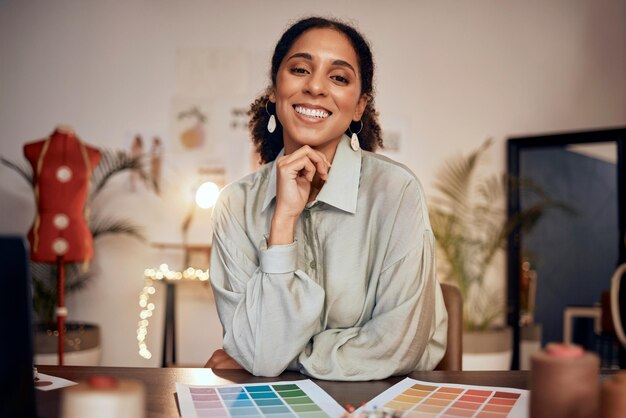 Fashion small business and portrait of black woman designer at desk in creative office Startup owner woman business owner and happy smile confident manufacturing luxury clothes for online shop