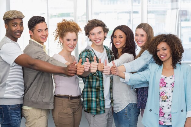 Fashion students showing thumbs up