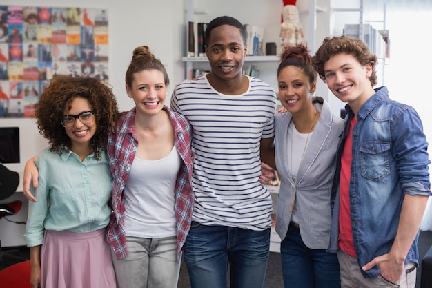 Fashion students smiling at camera together