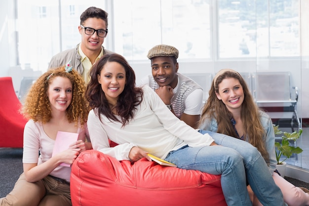 Fashion students smiling at camera together