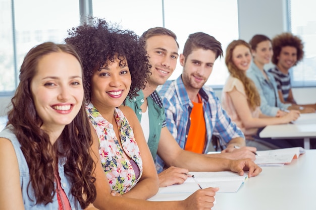 Fashion students taking notes in class