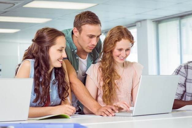 Fashion students using laptop