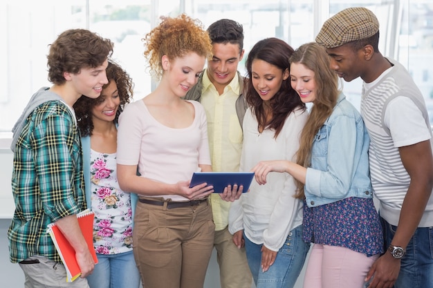 Fashion students using tablet together