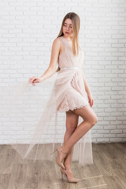 Fashion studio portrait of beautiful young fair hair woman