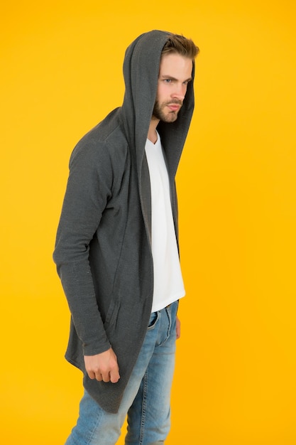 Fashion trends Modern clothes for youth Sporty style Comfy garment for daily life Fashion man yellow background Fashion look Handsome guy wear fashionable mantle with hood Casual wear for men