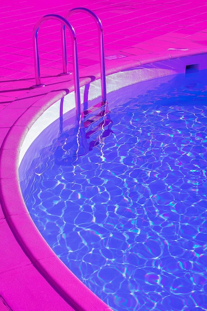 Fashion tropical minimal location.  Swimming pool space. Vapor wave purple colours style wallpaper.  Travel aesthetics