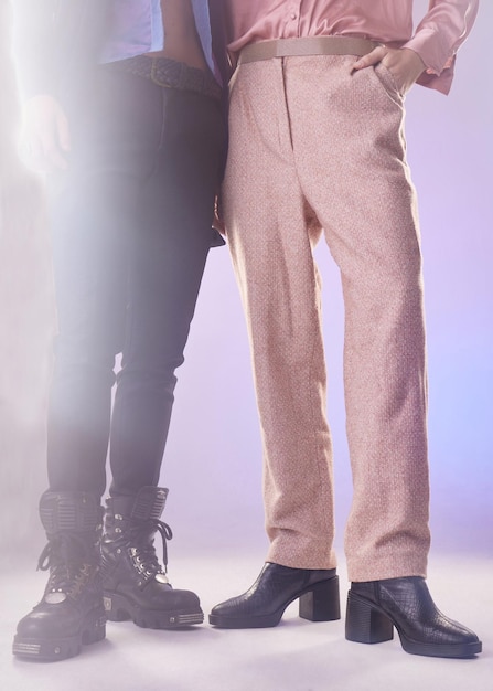 Photo fashion vintage and closeup of pants in a studio for a retro trendy and stylish outfit style glitter and gay men with edgy style and elegant clothes and boots by a purple gradient background