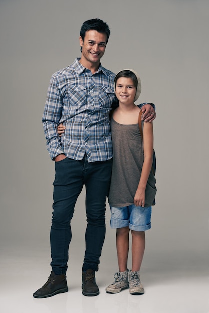 In fashion we stand Studio shot of a trendy father and son against a gray background