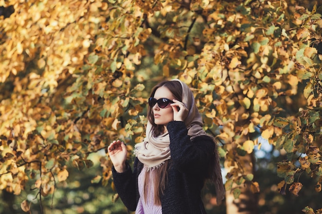 Fashion woman in autumn park