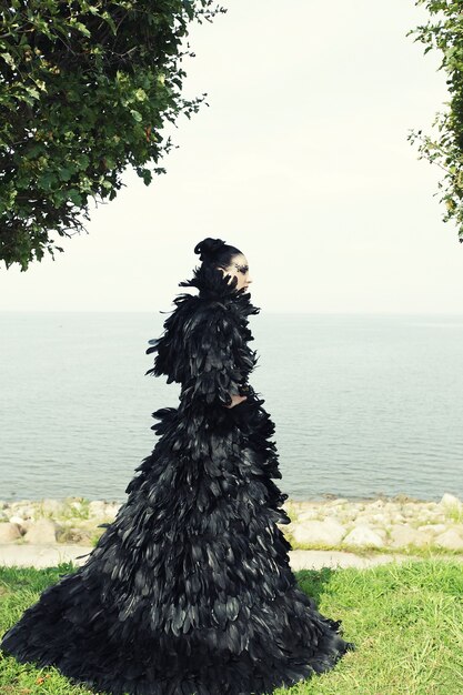 Fashion woman posing near the sea