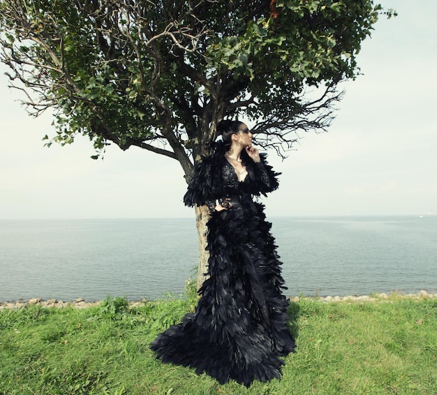 Fashion woman posing near the sea