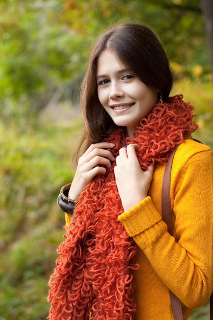 Fashion woman walking in autumn park