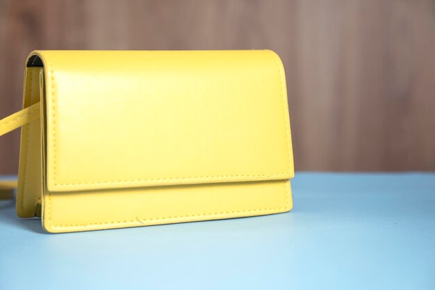 Fashion yellow bag on table