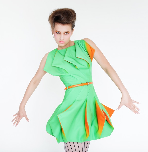 Fashion young model in bright green dress