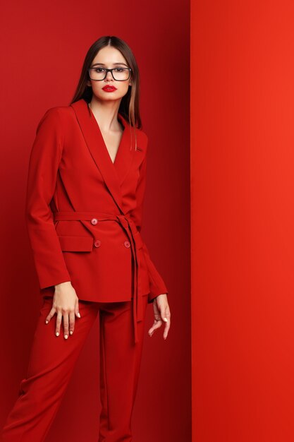 Fashion young woman in red suit