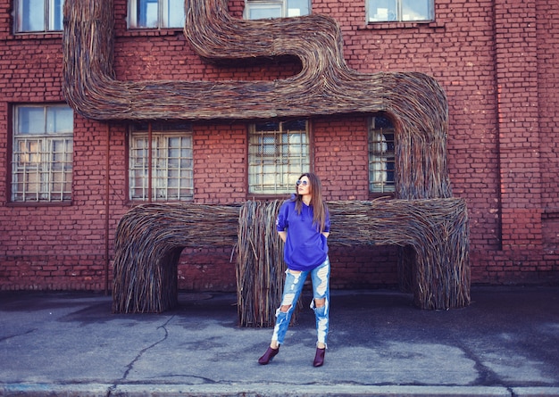 Fashion young woman wearing a blue hoodie