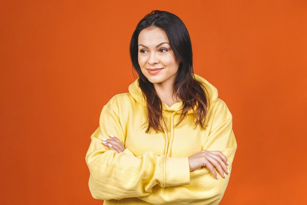 Fashionable beautiful  young female student wearing stylish clothing laughing