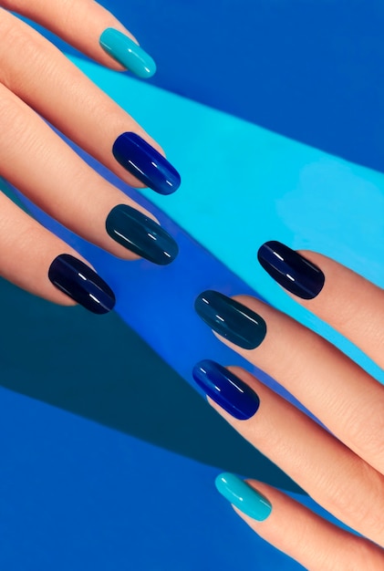 Fashionable blue manicure on oval shaped nails