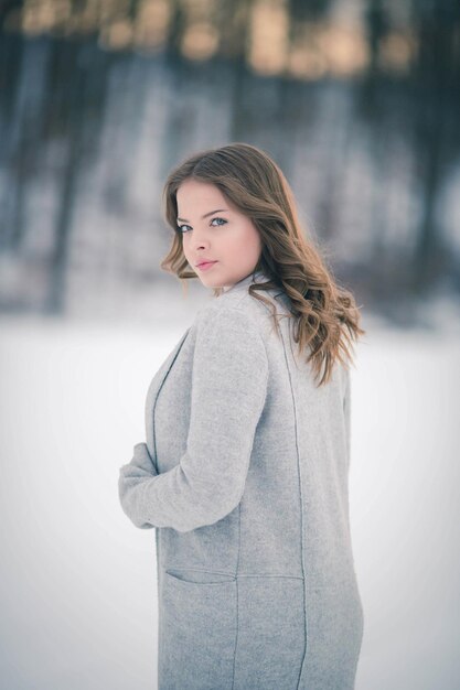 Fashionable Bosnian Caucasian woman looking at the camera with a serious face