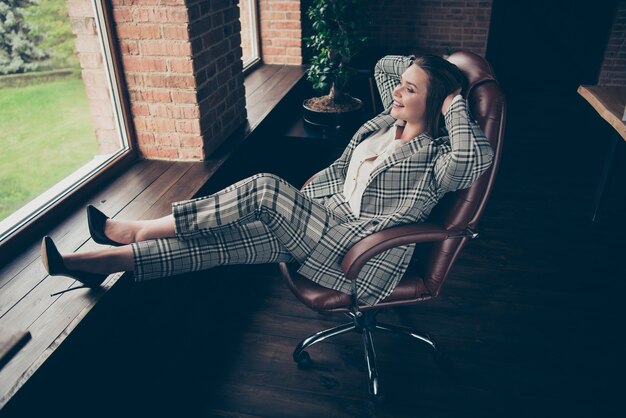 Fashionable businesswoman posing indoors