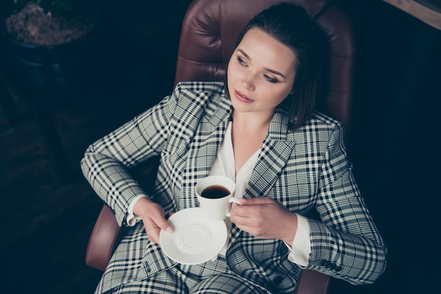 Fashionable businesswoman posing indoors