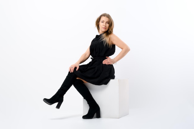 Fashionable elegant senior woman posing in studio