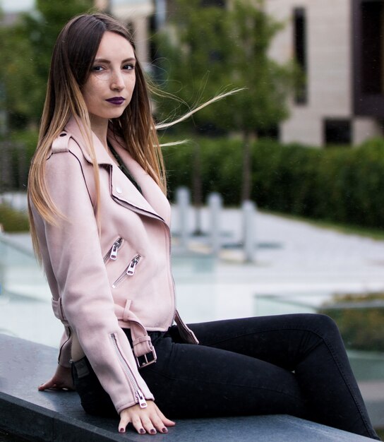 fashionable girl near modern building