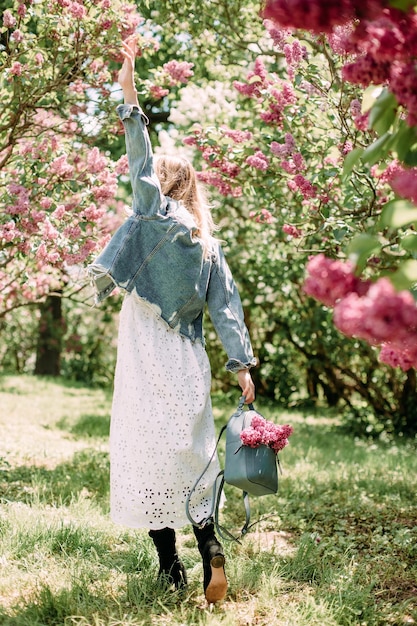 Fashionable girl sakura garden lifestyle walk rest