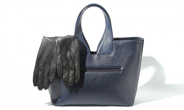 Fashionable leather bag, gloves on white, autumn female accessories
