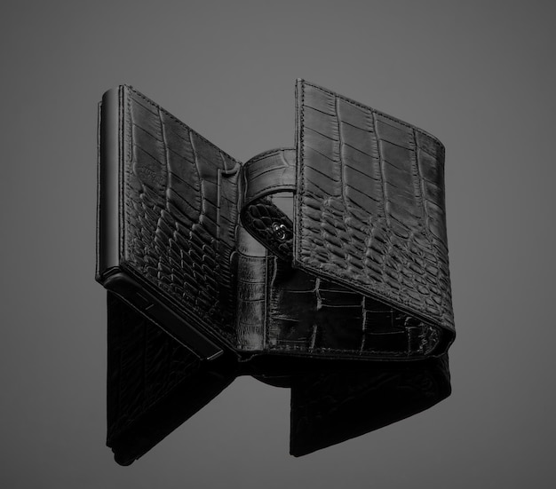 Fashionable leather men's wallet on a dark background