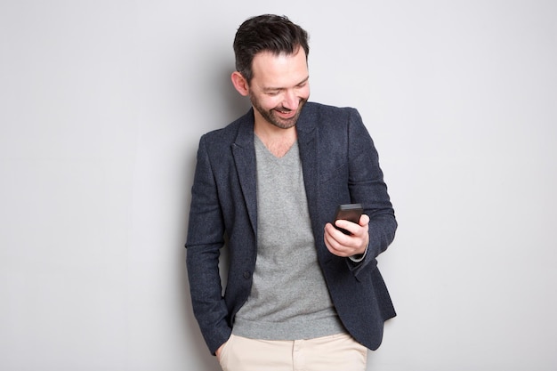 Fashionable man looking at cellphone