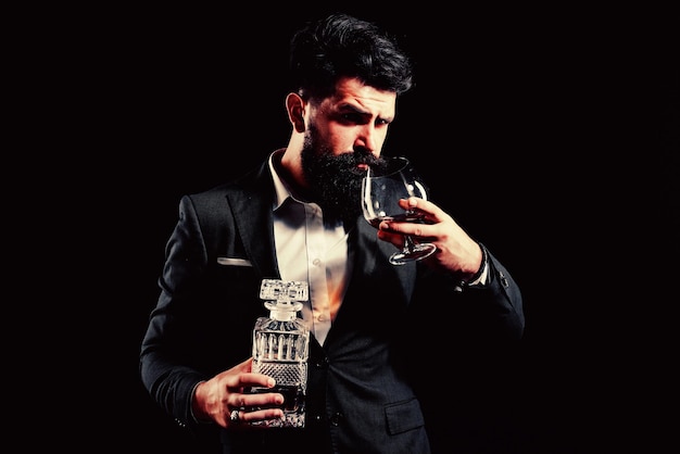 Fashionable man in white shirt and suspenders Man drinking alcohol from glass Alcohol Drink Drinking