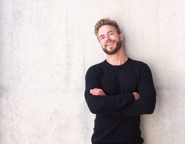 Fashionable man with beard laughing 