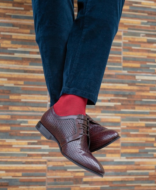 Fashionable men's shoes with beautiful feet in socks