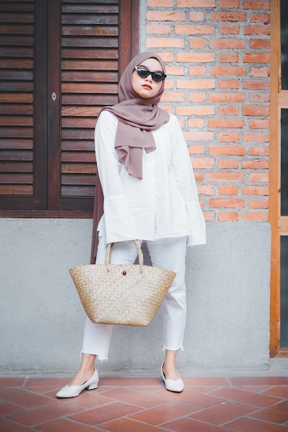 Fashionable Muslim woman wearing hijab and sunglasses