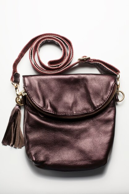 Fashionable small brown leather woman's bag with decoration