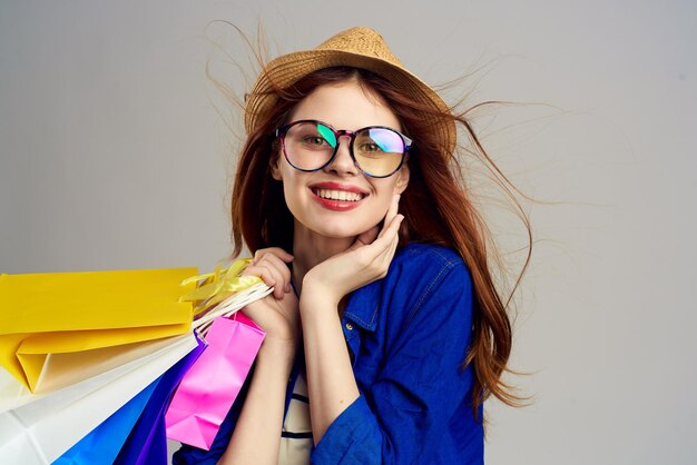 Fashionable woman in hat with glamor shopping bags person